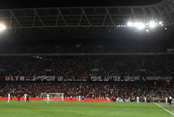 Nice's supporters display a banner reading "OM: support an LGBT team to fight against homophobia" during the French L1 football match between OGC Nice and Olympique de Marseille (OM) on August 28, 2019 at the "Allianz Riviera" stadium in Nice, southeastern France. (Photo by VALERY HACHE / AFP)
